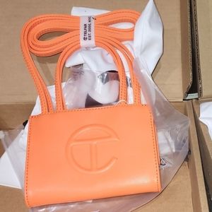 Small orange Telfar bag